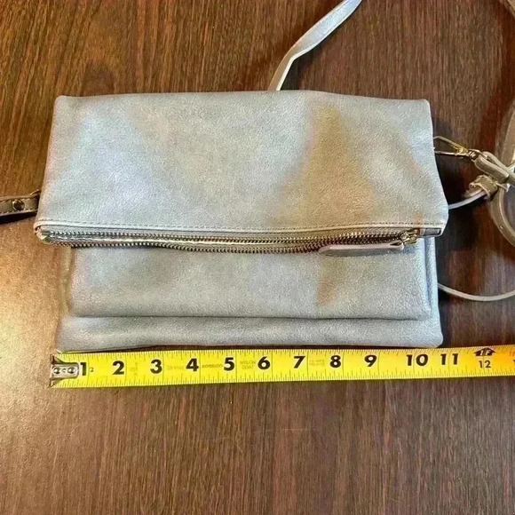 Grey Fold over Purse. Wristlet Strap. Shoulder Strap. Pockets. Zipper. Snap. - Picture 7 of 7